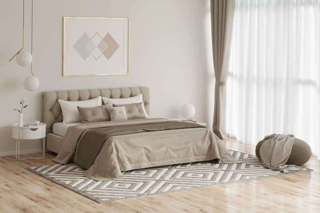 Cozy bedroom in warm colors with painting, a nightstand, a pouf, and a plaid Interior Painting During Winter